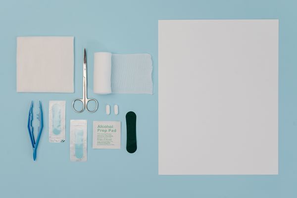 Gauze, bandage and scissors laid out flat